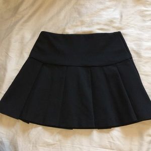 Black pleated mini skirt